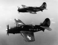 Asisbiz Curtiss SB2C 4 Helldivers VB 83 White 305 and 311 over CV 9 USS Essex 01