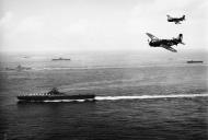 Asisbiz Curtiss SB2C 4 Helldivers VB 83 White 315 over USS Bunker Hill Okinawa May 1945 01