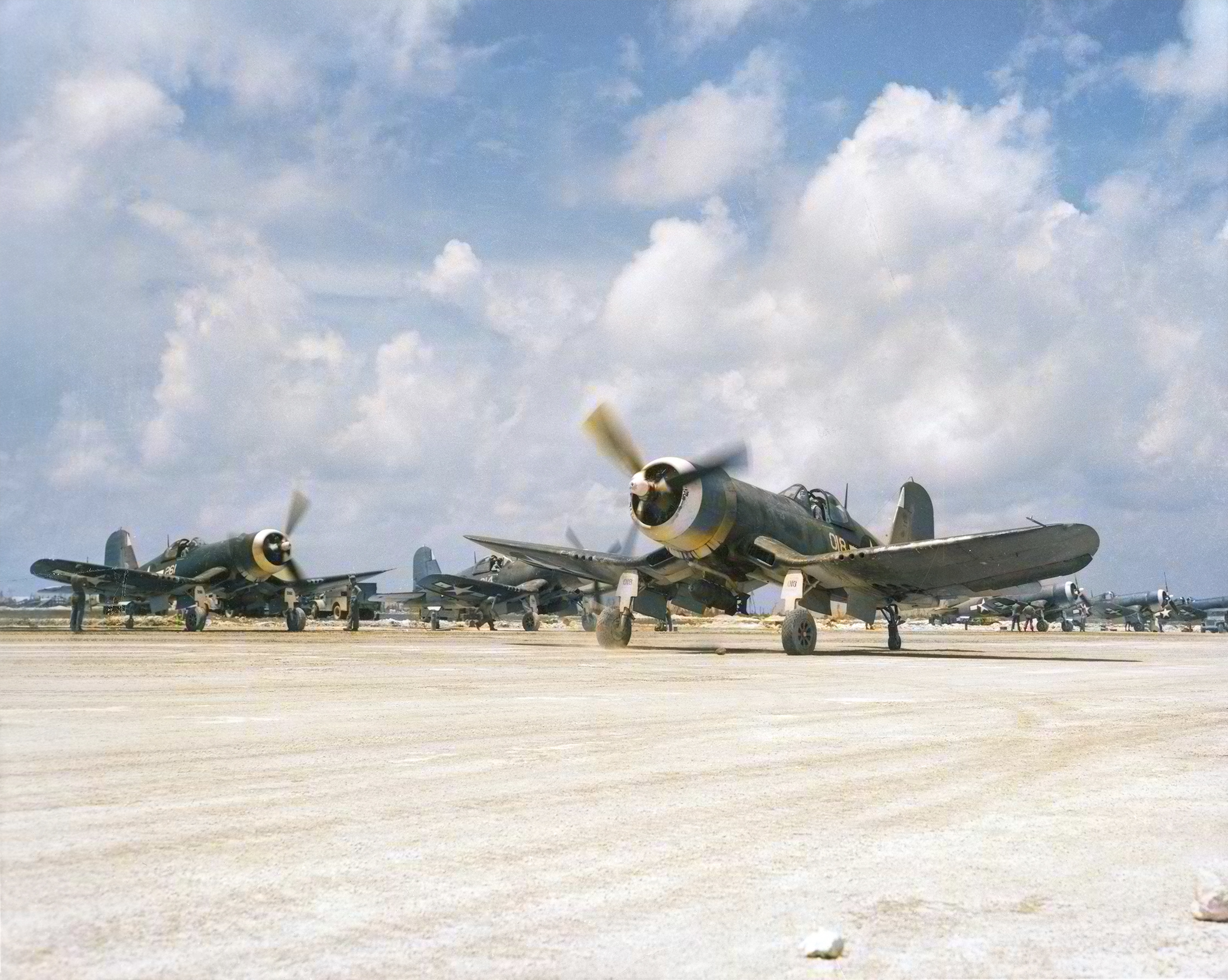 Vought F4U-1A Corsair 2MAW VMF-114 Death Dealers White 018 carrying a 1000ib bomb taxiing at Peleliu's airstrip 17th Oct 1944 ASC1