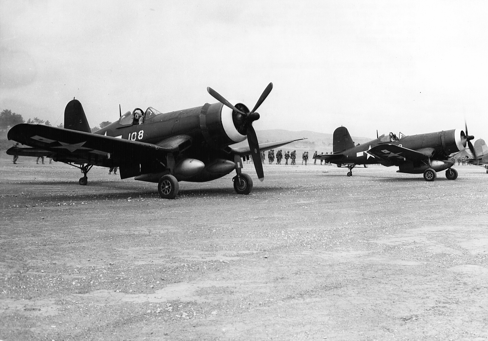 Vought F4U-1D Corsair 2MAW VMF-114 Death Dealers White 108 fully loaded awaits its next sortie on Kadena Okinawa 9th Aug 1945 01