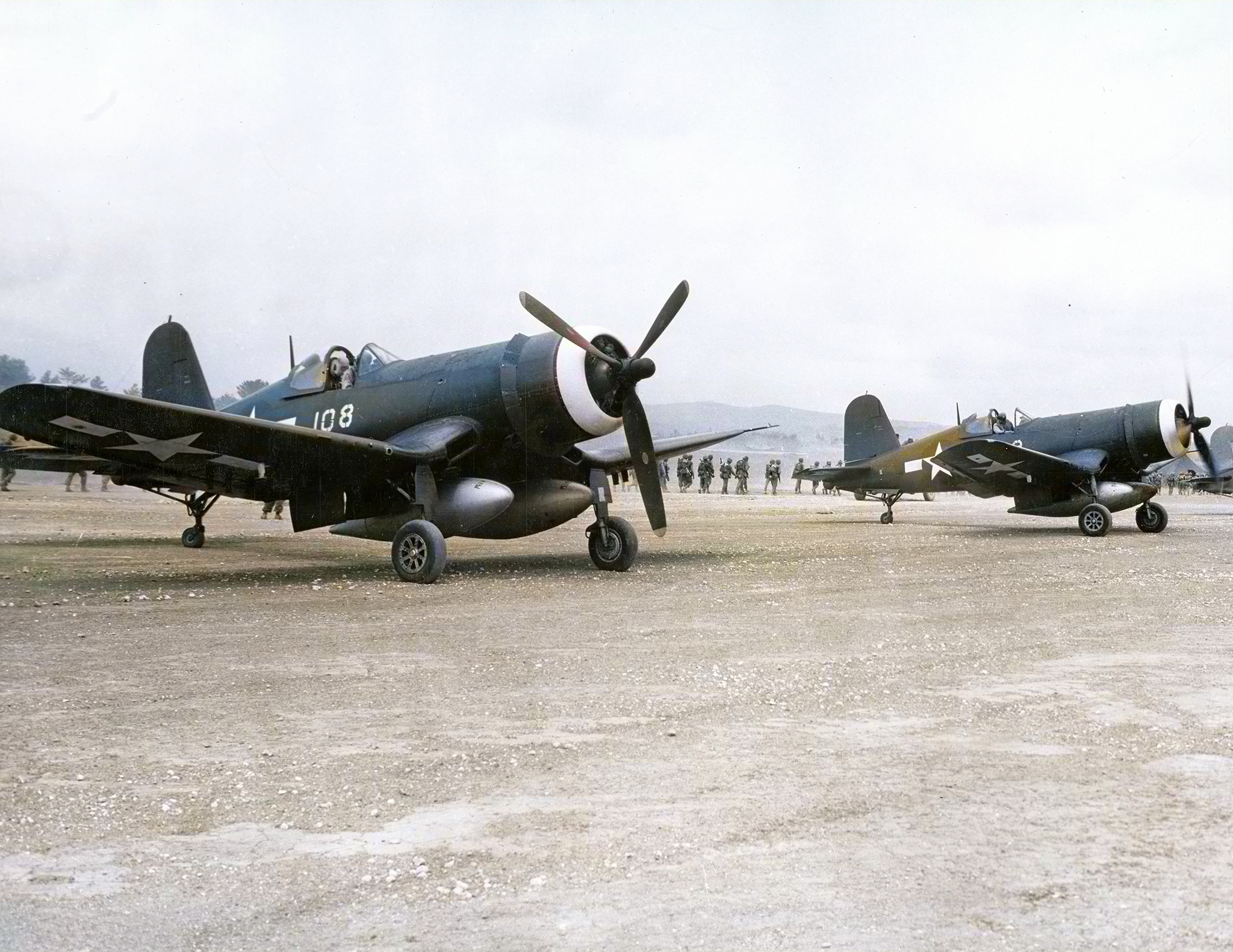 Vought F4U-1D Corsair 2MAW VMF-114 Death Dealers White 108 fully loaded awaits its next sortie on Kadena Okinawa 9th Aug 1945 ASC1