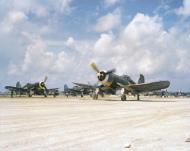 Asisbiz Vought F4U-1A Corsair 2MAW VMF-114 Death Dealers White 018 carrying a 1000ib bomb taxiing at Peleliu's airstrip 17th Oct 1944 ASC1
