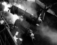 Asisbiz Vought F4U-1D Corsair VMF-123 White 38 burns after a landing misshap USS Bennington (CV 20) 14th Feb 1945 01