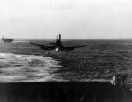 Asisbiz Vought F4U 1D Corsair VMF 124 White 88 landing aboard CV 9 USS Essex 25th Jan 1945 01