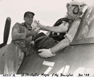 Asisbiz Aircrew USMC VMF 214 Maj Boylngton hands the meatball tokens to Lt Magee in exchange for the Cardinals caps 4th Dec 1943 01
