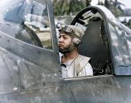 Asisbiz Aircrew USMC VMF 214 Maj Gregory Pappy Boyington seated in his Corsair at Guadalcanal 1st May 1943 01