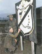 Asisbiz USMC VMF 214 sign board being used in Korea 1950s 01