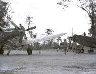 Asisbiz Vought F4U-1A Corsair VMF-222 White 946 as pilots scramble to their planes on Bougainville 14th Feb 1944 NARA