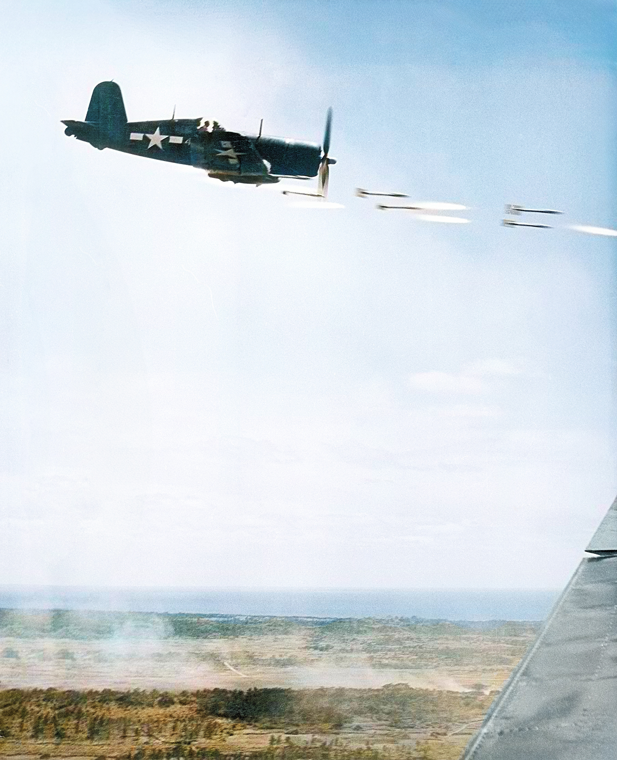 Goodyear FG 1D Corsair VMF 323 White 40 firing a salvo of rockets over Okinawa Japan Apr 1945 ASC