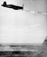 Asisbiz Goodyear FG 1D Corsair VMF 323 White 40 firing a salvo of rockets over Okinawa Japan Apr 1945 01