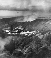 Asisbiz Goodyear FG 1D Corsair VMF 323 White 40 firing a salvo of rockets over Okinawa Japan Apr 1945 03