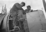 Asisbiz Fokker D XXI FAF FAF mechanics perform pre mission maintenance checks at Tiiksjarvi 25th May 1942 89180