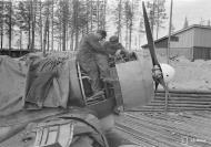 Asisbiz Fokker D XXI FAF mechanics perform pre mission maintenance checks at Tiiksjarvi 25th May 1942 89179