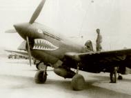 Asisbiz Curtiss P 40E Warhawk 23rd Fighter Group with with shark mouth design and carring a drop tank 01