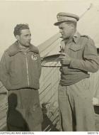 Asisbiz RAF Intelligence Officer interrogates an Italian Black Cat fighter pilot who survived a midair AWM MED0176