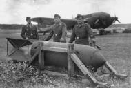 Asisbiz Heinkel He 111 bomber crew standing by a SC 1800 Satan bomb 01