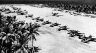 Asisbiz Large photo of a Tropical airstrip showing amongst other things a squadron of parked Hellcats 01