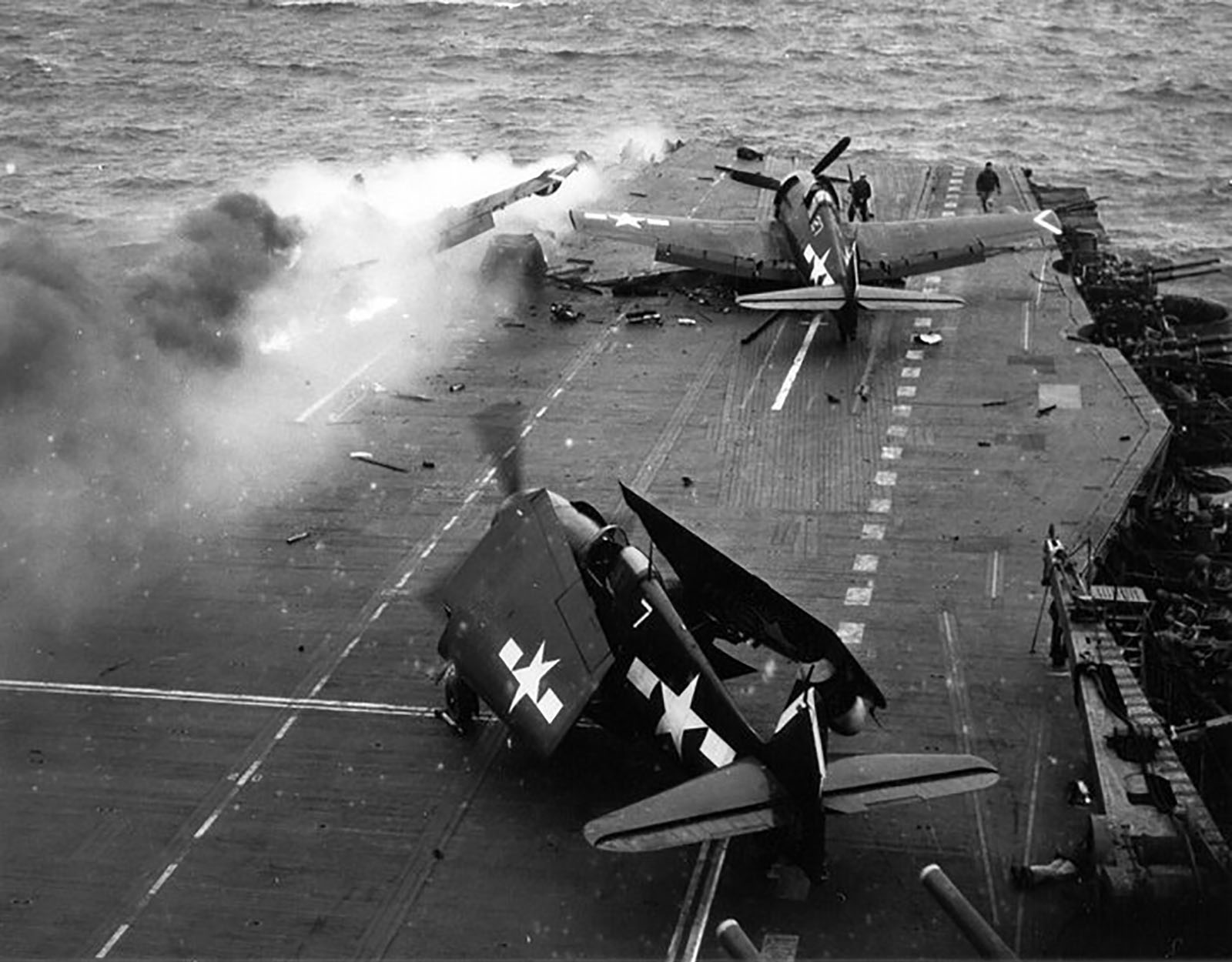 Grumman F6F 5N Hellcat VFN 53 White 7 and 27 after a kamikaze attack CV 3 USS Saratoga 21st Feb 1945 01
