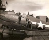 Asisbiz Aircrew USN pilot climbing aboard his Grumman F6F Hellcat 01