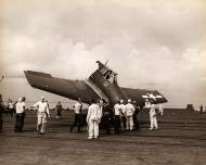 Asisbiz Aircrew USN pilot climbing out of his Grumman F6F Hellcat after a bad landing 01