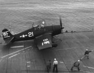 Asisbiz Grumman F6F 5N Hellcat MCVG 1 White WF21 preparing for launch 01