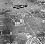 Asisbiz Grumman F6F 5N Hellcat White SS9 fighter over the countryside Kakogawa Japan 12th Sep 1945 80G455770