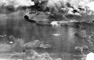 Asisbiz Japanese shipping under attack by Task Force 58 planes in a Palaus Harbor 29 30 Mar 1944 80 G 45323