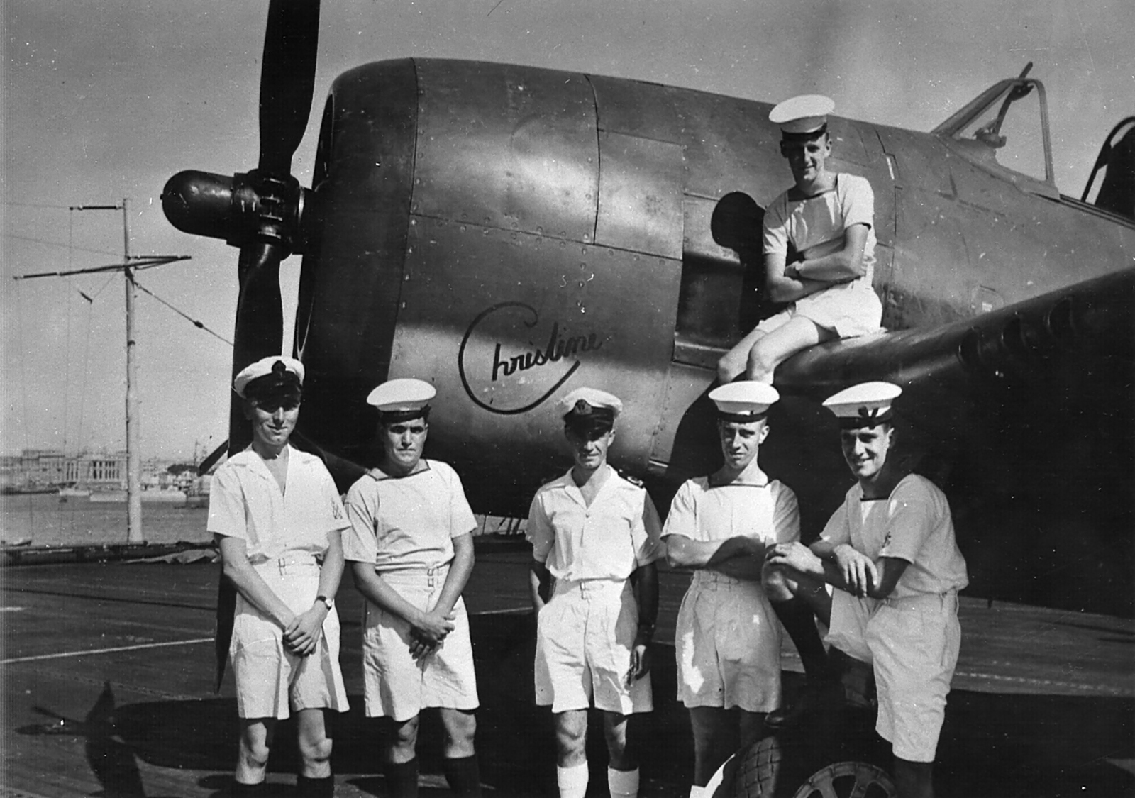 Royal Navy personnel posing against a Helcat 01