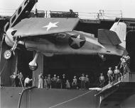 Asisbiz Grumman F6F 3 Hellcat VF 1 White 22 being loaded onto the USS Yorktown 01