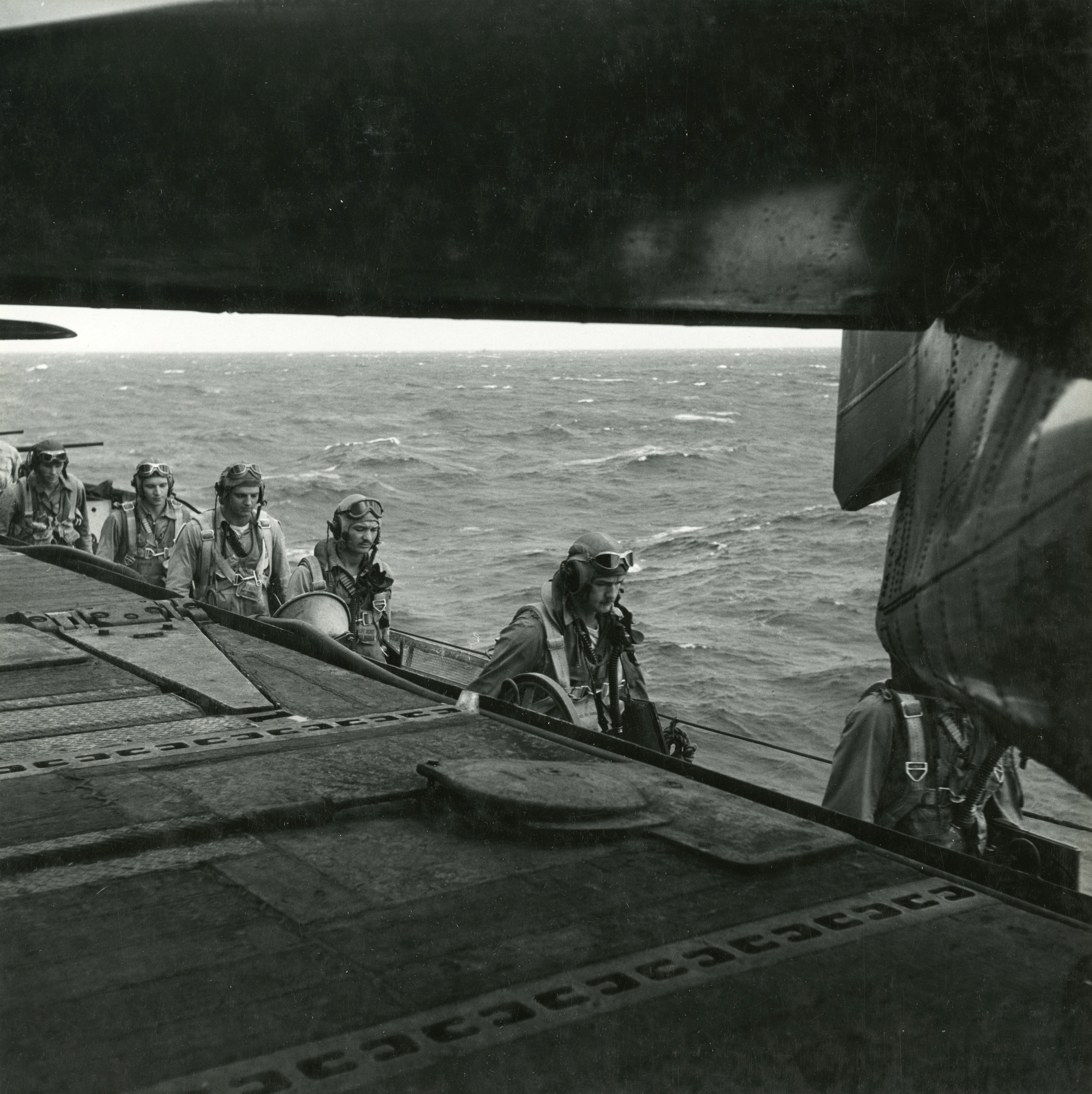 Grumman F6F 5 Hellcat VF 11 Sundowners pilots walking to their aircraft CV 12 USS Hornet Nov 1944 01