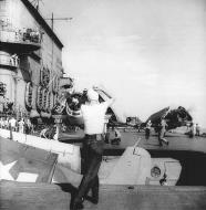 Asisbiz Grumman F6F 3 Hellcat VF 12 in the hangar deck elevetator CV 3 USS Saratoga 1943 44 01