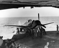 Asisbiz Grumman F6F 3 Hellcat VF 15 being catapulted in a hangar deck launch off CV 12 USS Hornet 01