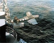 Asisbiz Grumman F6F 3 Hellcat fighter of VF 15 being catapulted from USS Hornet II (CV 12) via the hangar catapult 25th Feb 1944 01