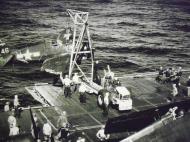 Asisbiz Grumman F6F 3P Hellcat VF 15 White 46 being rescued aboard CV 9 USS Essex 01