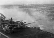 Asisbiz Aircrew USN VF 19 Hellcats on deck CV 16 under attack Nov 1944