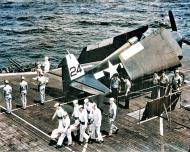 Asisbiz USS Bataan (CVL 29) F6F 5 Hellcat VF 47 sits on the flight deck during a burial ceremony off Okinawa 18th Apr 1945 01