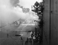 Asisbiz Grumman F6F 5 Hellcat VF 53 White 59 during kamikaze attack CV 3 USS Saratoga 21st Feb 1945 03