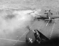Asisbiz Grumman F6F 5 Hellcat VF 53 White 7 and 27 during kamikaze attack CV 3 USS Saratoga 21st Feb 1945 01
