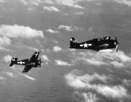 Asisbiz Grumman F6F 5 Hellcat VF 82 White 62 and 72 from CV 20 USS Bennington 1945 areial shot 01