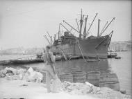 Asisbiz Merchant ship Orari freight being emptied in Grand Harbour Malta 16th Jun 1942 IWM A10417