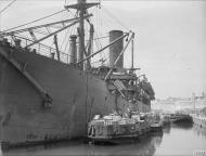 Asisbiz Merchant ship Troilus freight being emptied in Grand Harbour Malta 16th Jun 1942 IWM A10407