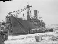 Asisbiz Merchant ship Troilus freight being emptied in Grand Harbour Malta 16th Jun 1942 IWM A10408