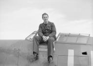 Asisbiz Aircrew RAF 242Sqn FO Hugh Tamblyn seated on Douglas Bader aircraft Duxford Sep 1940 IWM CH1410