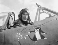 Asisbiz Aircrew RAF Wing Commader Ian Gleed showing a cartoon of Figaro the cat batting a swastika Tunisia 1943 IWM5005