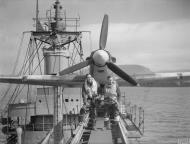 Asisbiz MSFU Sea Hurricane aboard CAM ship SS Empire Tide at Hvalfjord Iceland 14th Jun 1942 IWM A10112