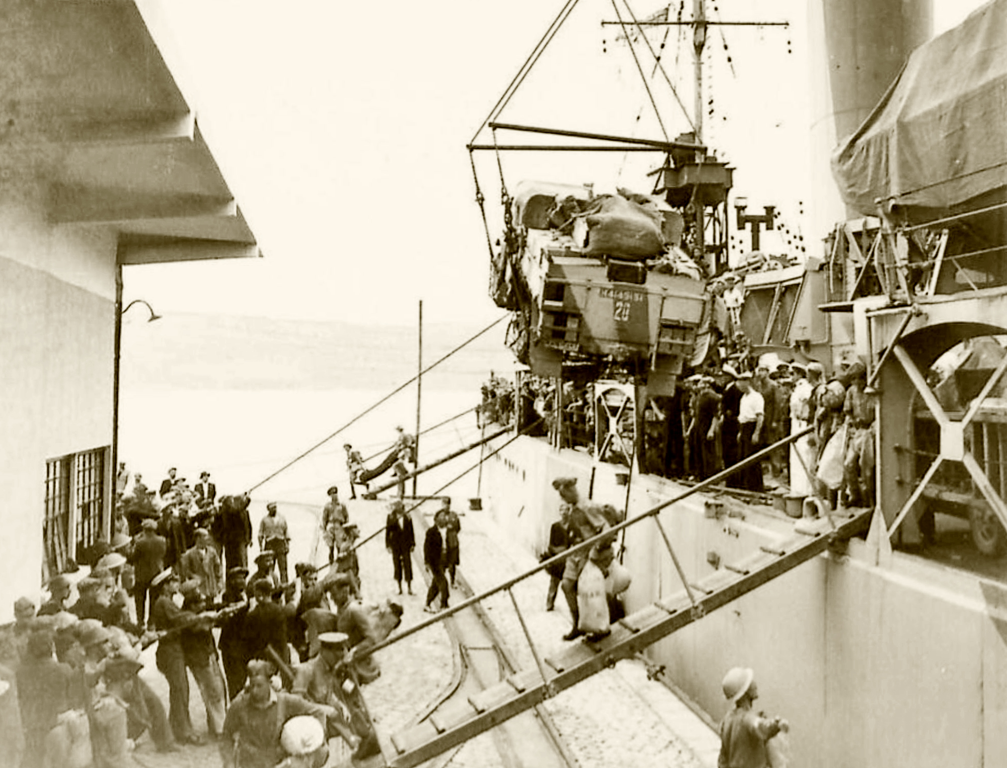 Reinforcing Crete MT being disembarked from the warship IWM E1161