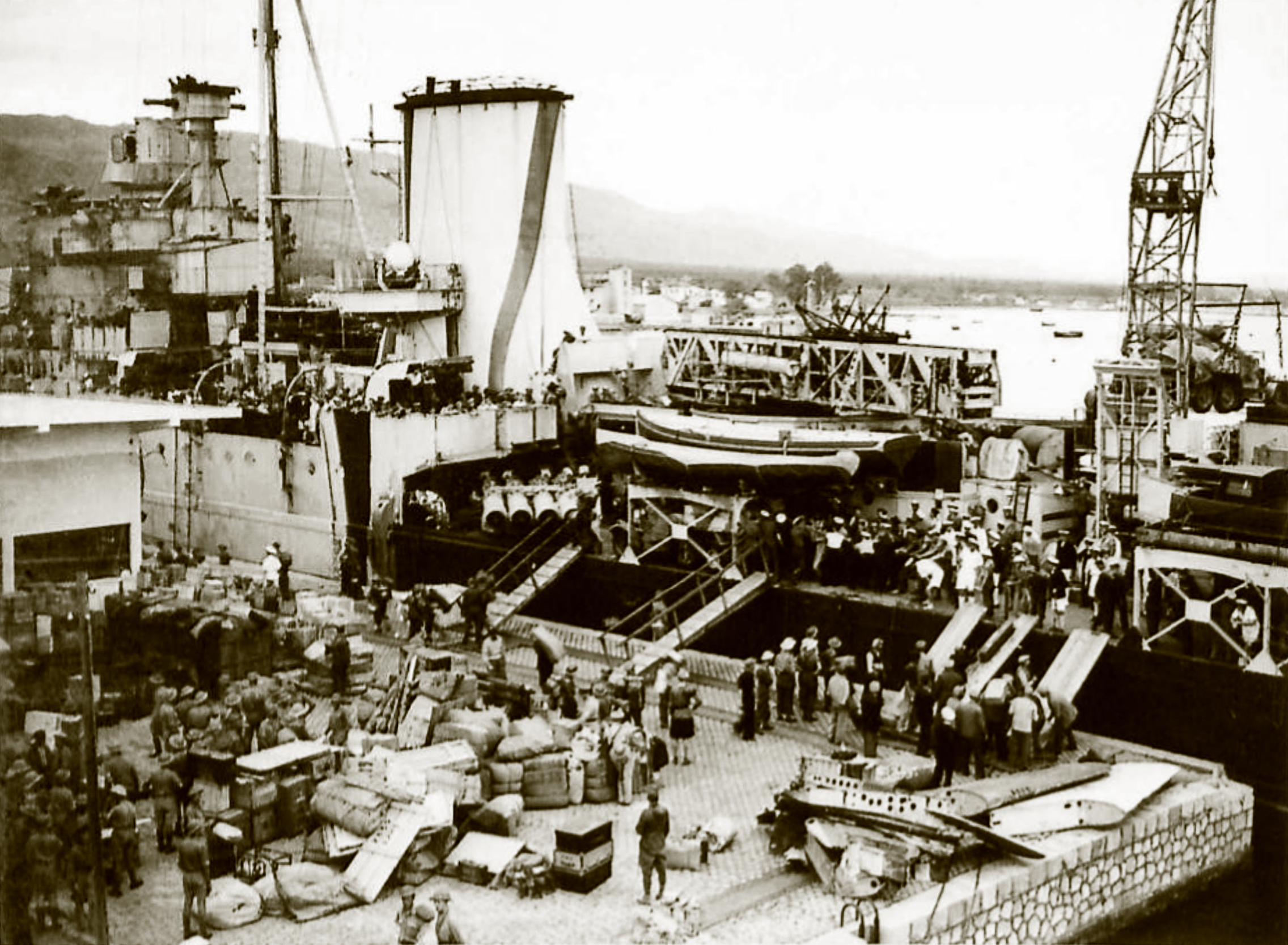 Reinforcing Crete scene on the quayside as the warship was disembarking men and material IWM E1158