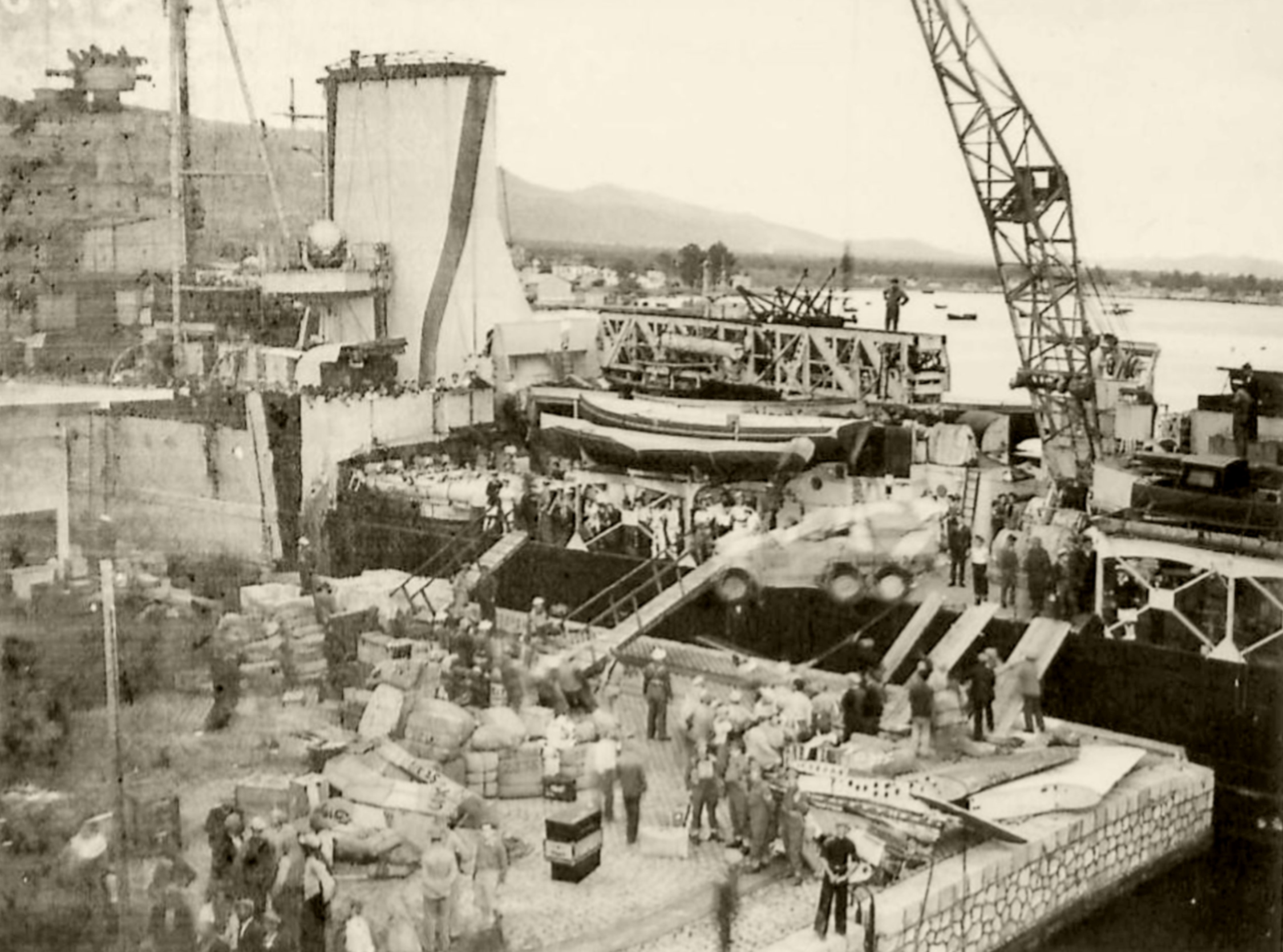 Reinforcing Crete scene on the quayside as the warship was disembarking men and material IWM E1159