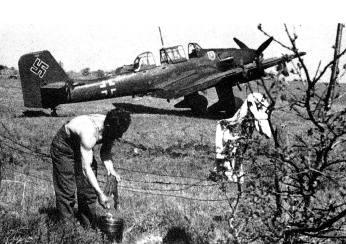 Junkers Ju 87B2 Stuka III.StG2 crew member doing his washing Balkans 1941 01