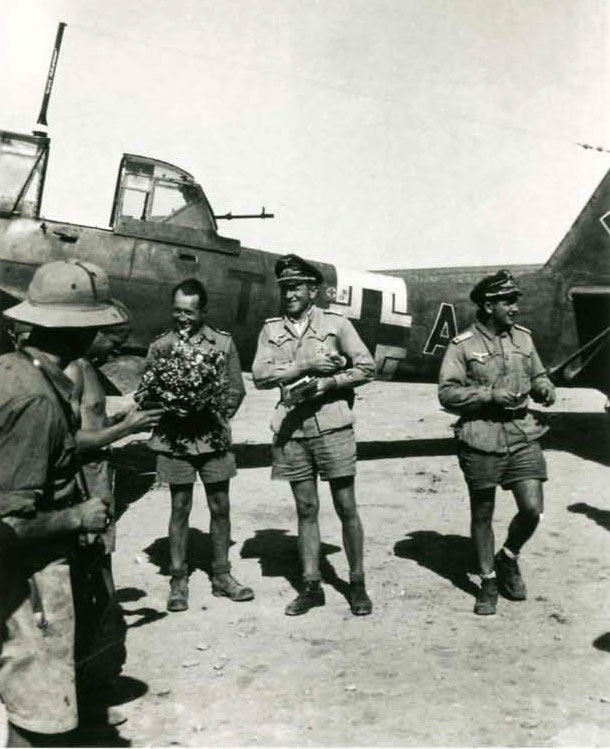 Junkers Ju 87R2 Stuka Stab I.StG2 (T6+AB) Kurt Kuhlmey receives flowers in North Africa 01